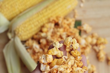 Popcorn with butter and fresh corn cob.