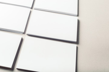 blank business cards on grey background