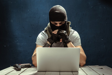 Terrorist working on his computer
