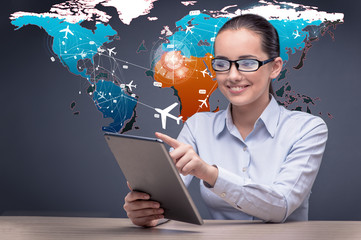 Young businesswoman in online travel booking concept
