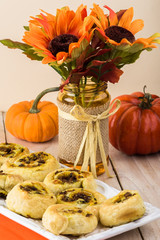 Fresh baked homemade beef pumpkin pinwheels.