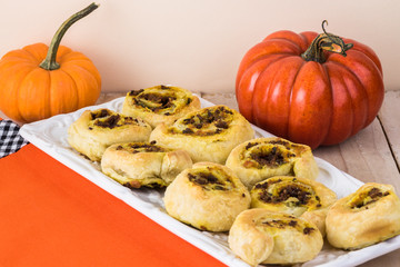 Fresh baked homemade beef pumpkin pinwheels.