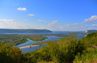 Fototapeta na wymiar Panoramic view from the hill on the the Volga river near Samara city at sunny day. Beautiful natural landscape. Russia.