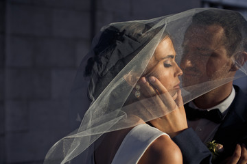 The lovely groom looks at his wife