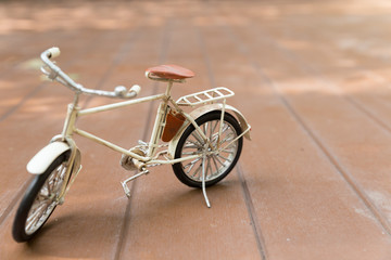 Fototapeta na wymiar bicycle model on wood floor