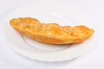 cheburek with lamb on white plate