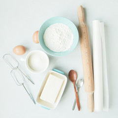 Fototapeta na wymiar Baking ingredients and kitchenware on grey background