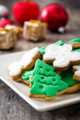 Christmas cookies on a plate and wooden table background

