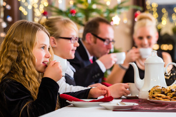 Family having traditional Christmas coffee time