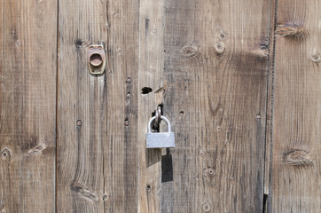 padlock on a wooden old door