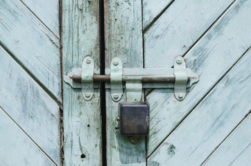 padlock on a wooden old door