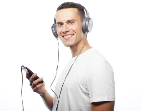 life style and people concept:Young man enjoying music on his he