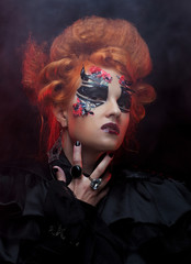 Gothic redhair witch. Dark woman. Halloween picture.