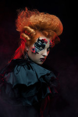 Gothic redhair witch. Dark woman. Halloween picture.