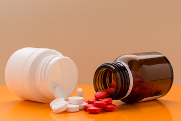 Vrious round pills and pill bottle