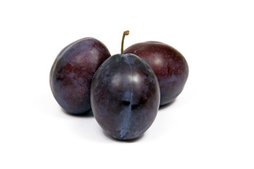 Plums on white background isolated