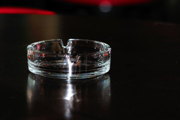 glass ashtray on a table in the bar