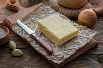 Butter and bread for breakfast, a rustic background