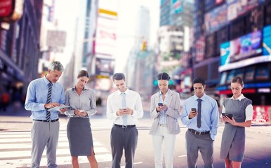 Composite image of business people using their phone 