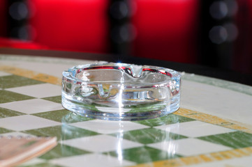 glass ashtray on a table in the bar