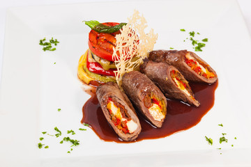 meat rolls with sauce and vegetables cheese