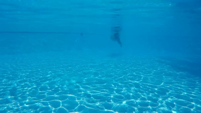 man swimming in the pool