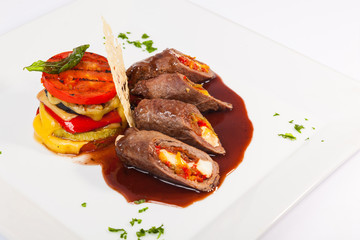 meat rolls with sauce and vegetables cheese