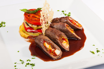 meat rolls with sauce and vegetables cheese