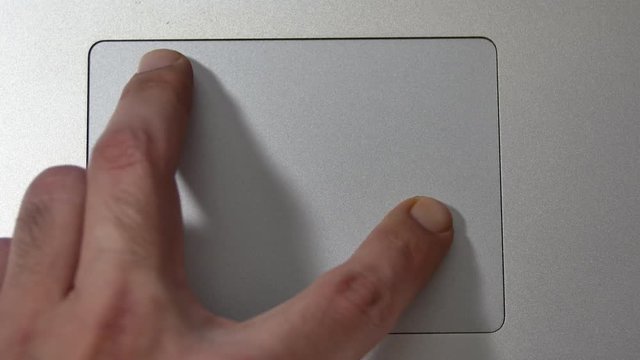 Hand Gestures Over The Track Pad Of A Laptop, Zooming In And Out, Flipping Pages
