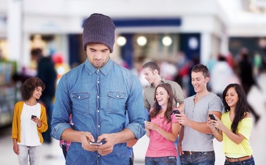 Composite image of hipster using mobile phone