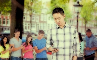 Composite image of young man using smart phone 