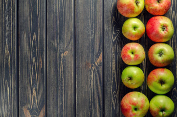 Apples and beries  on wooden background. Thanksgiving, autumn, handmade