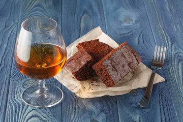 Chocolate fudge brownie with cup of espresso coffee