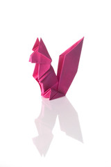 Cute origami art, colored squirrel isolated over a white background