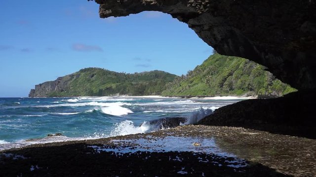 Coastal landscape with waves breaking on the sea shore of Rurutu island, south Pacific ocean, Austral archipelago, French Polynesia
