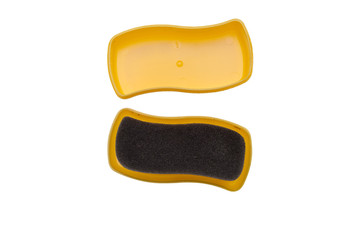 Shoe shine foam brush saturated with neutral polish