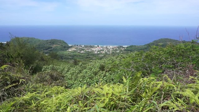Coastal landscape, viewpoint over the village of Auti from the heights of the island of Rurutu, south Pacific ocean, Austral archipelago, French Polynesia
