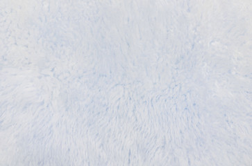 Closeup surface abstract fabric pattern at the light blue fabric carpet made from wool at the floor of house texture background