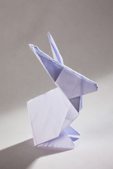 Cute origamis art, colored rabbit shapes isolated over a white background