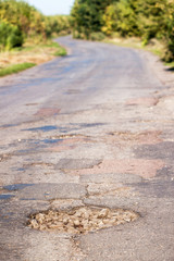 Large pit on the road.