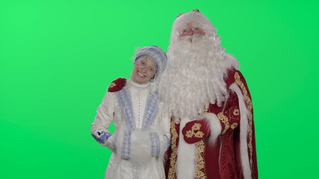 Ded Moroz (Santa Claus) and snow maiden happy New year and Christmas. Green screen, chromakey