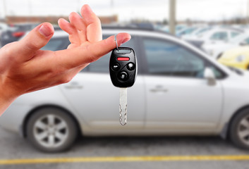 Dealer hand with a car key.