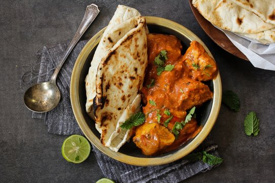 Butter Chicken served with homemade Indian Naan bread