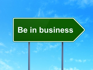 Finance concept: Be in business on road sign background