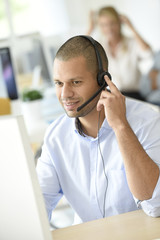Customer service operator working in office