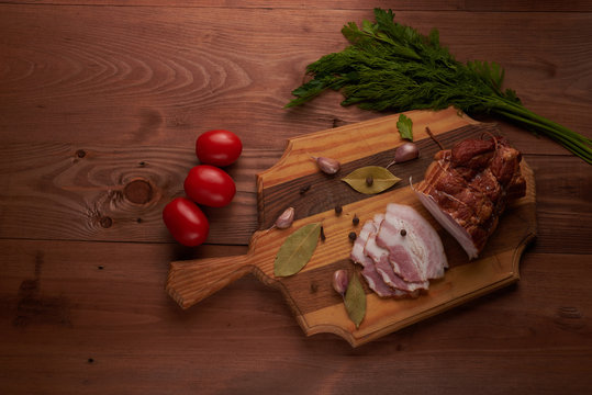 bacon and seasonings on a wooden table