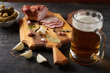 bacon and glass of beer on a table