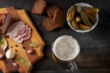 bacon and glass of beer on a table