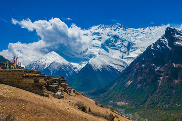 Fototapeta na wymiar Landskape Photo Tracking Himallaya Vilage Side Hill.View Snow Nepal Mountans Background. Hikking Sport Travel. Horizontal.