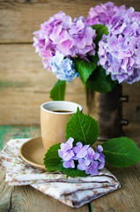 Obraz na płótnie Canvas Hydrangea flowers and coffee